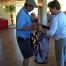 Jean Cronin, Assistant Director of CPSA, hands a raffle winner his brand new golf bag!